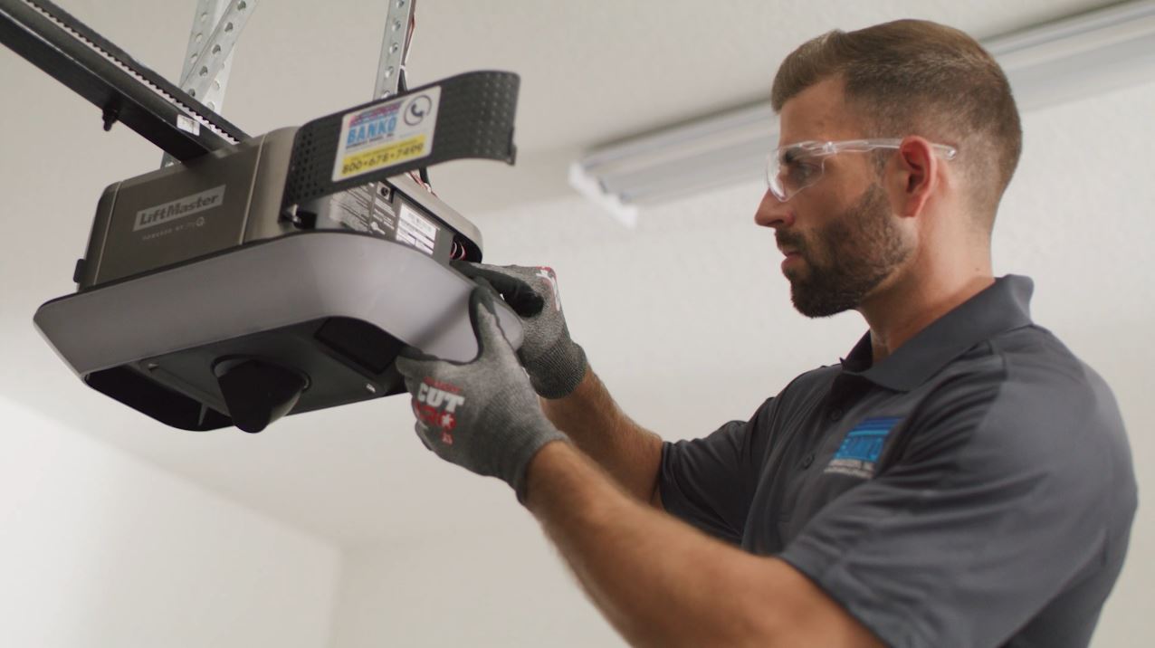 Banko Technician working on garage door opener repair